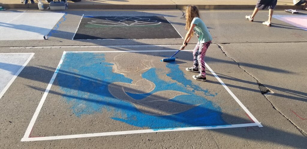 Painting a base layer for a chalk walk