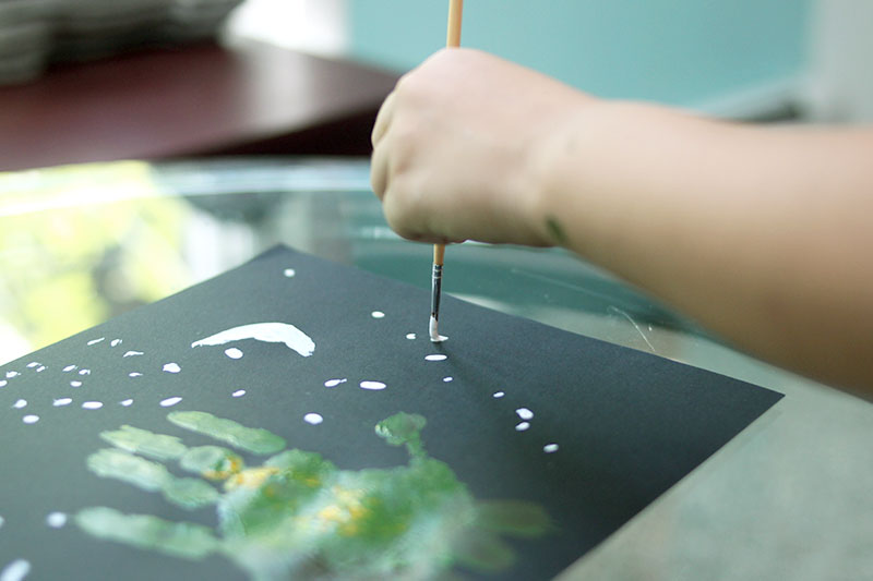 Nighttime stars for dinosaur painting preschool project